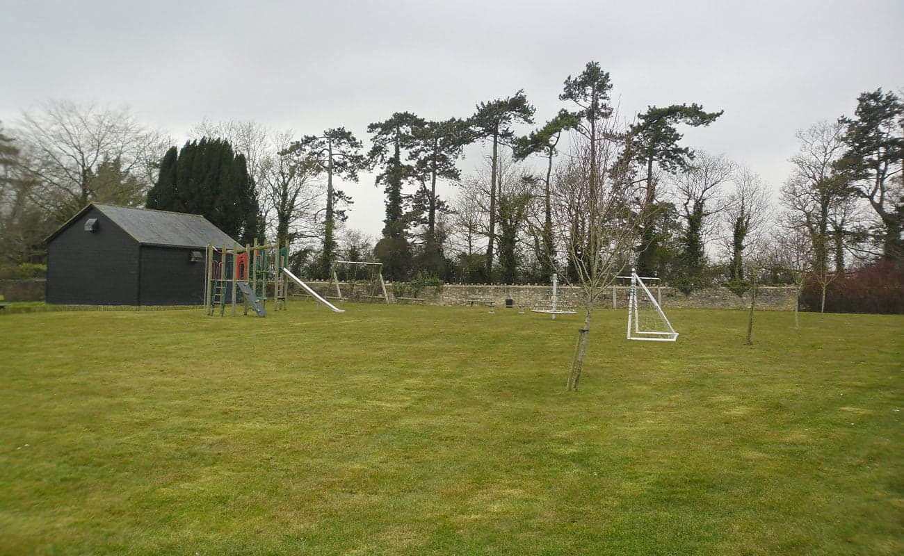 Mown school playing field with goalposts